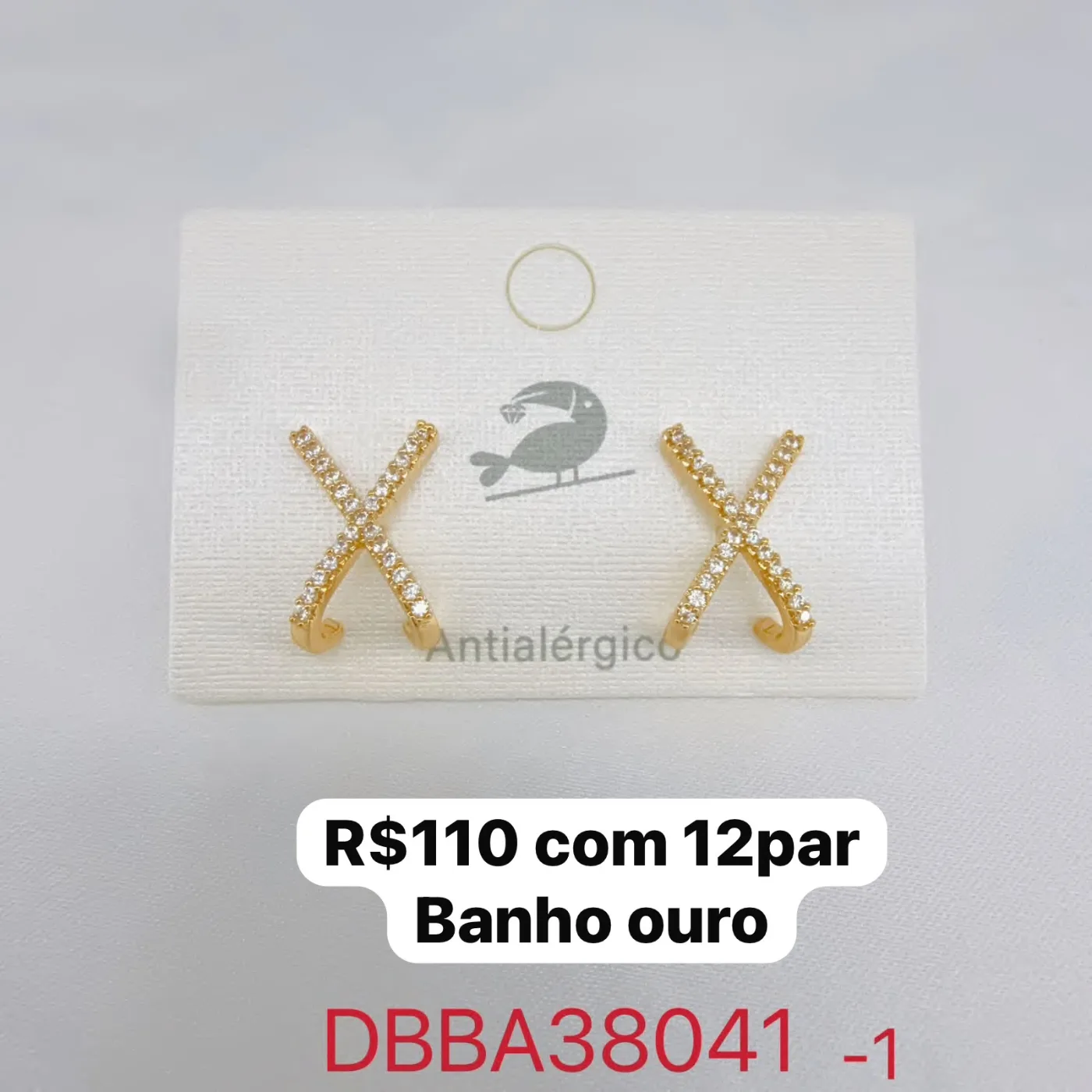 brinco cruzado com pedras